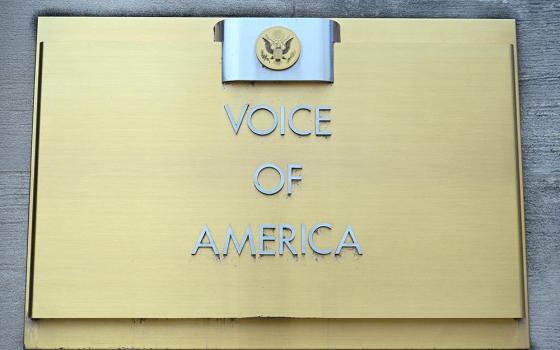 Signage is seen outside the Voice of America building March 16 in Washington, a day after more than 1,300 employees of the media broadcaster, which operates in almost 50 languages, were placed on leave. (OSV News/Reuters/Annabelle Gordon)