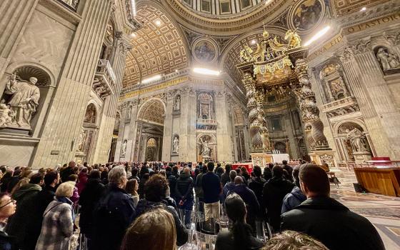 Catholics gather in St. Peter’s Basilica to pray the rosary for Pope Francis on the night of Saturday, March 1. (NCR photo/Camillo Barone)