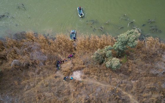 People are seen from above walking from rafts that had crossed the Rio Grande River toward Penitas, Texas, March 6, 2021. (CNS/ Reuters/Adrees Latif)