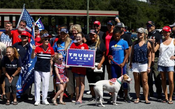 A group of supporters of President Donald Trump, holding signs and flags, in Atlanta Sept. 5 (CNS/Reuters/Dustin Chambers)