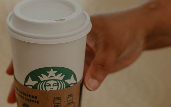 Starbucks coffee cup (Unsplash/Kadarius Seegars)