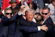  Republican presidential candidate and former U.S. President Donald Trump is assisted by security personnel after gunfire rang out during a campaign rally at the Butler Farm Show in Butler, Pennsylvania, July 13, 2024. (OSV News photo/Brendan McDermid, Reuters)
