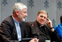 Cardinal Joseph W. Tobin of Newark, N.J., looks on at the Vatican Oct. 11 as Bishop Shane Anthony Mackinlay of Sandhurst, Australia, speaks at a press briefing on the synod. Tobin, Chicago Cardinal Blase Cupich and San Diego Cardinal Robert McElroy met with Pope Francis Oct. 10. The trio has not made public what they discussed at the meeting. (CNS photo/Lola Gomez)