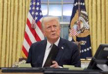 U.S. President Donald Trump signs documents in the Oval Office at the White House on Inauguration Day, Jan. 20  in Washington. He signed a series of executive orders including on immigration, birthright citizenship and climate. Trump also signed an order directing the U.S. government to only recognize two sexes, male and female. (OSV News/Reuters/Carlos Barria)