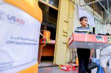 A boy is seen with relief goods at a U.S. Agency for International Development (USAID) distribution center in Gaza City. (OSV News/Shareef Sarhan, for Catholic Relief Services)